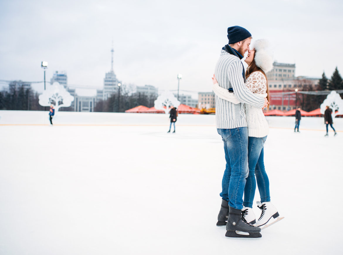 creative compromise at skating rink couple in embrace happy together
