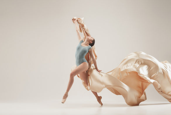 ballerina with silk fabric at the studio living her dream dancing