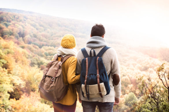 telltale signs of ghosting as couple stands looking out on autumn forest