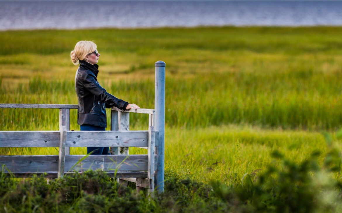healing power of love captured woman's attention while standing on a wood platform sightseeing