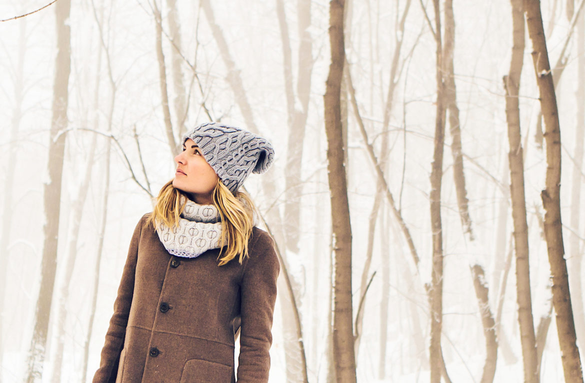 attracting the wrong people is a sign to take time alone as this woman basks in a park at winter
