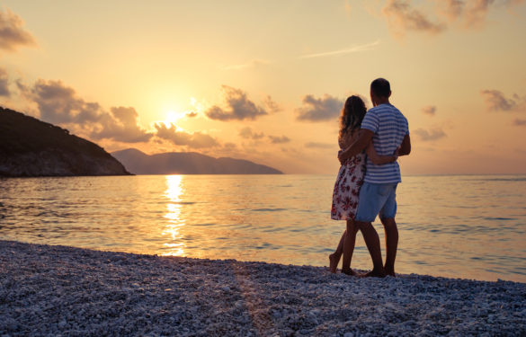 how to set the stage for love couple embracing on the beach enjoying the view at sunset