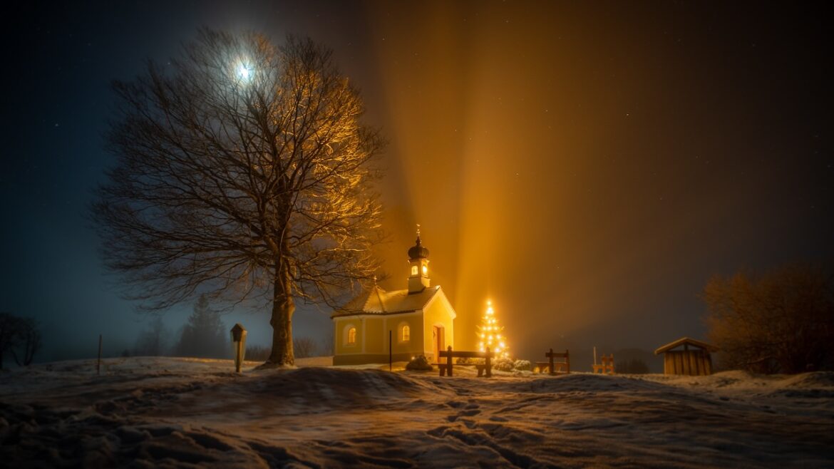 A prairie church basking in a silent night during the Christmas season.
