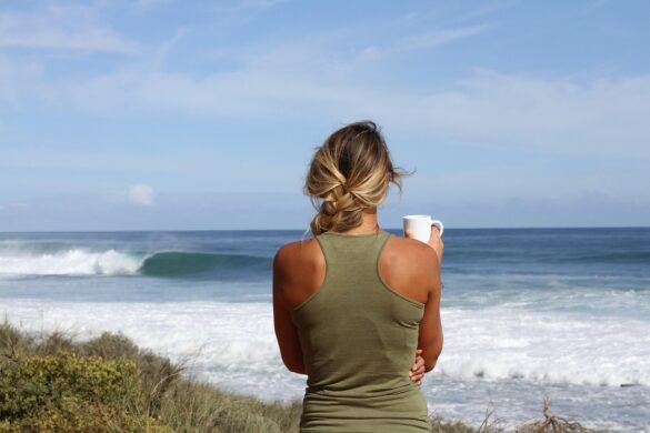 At the beach she faces the water, alone time is her guide to overcoming confusion
