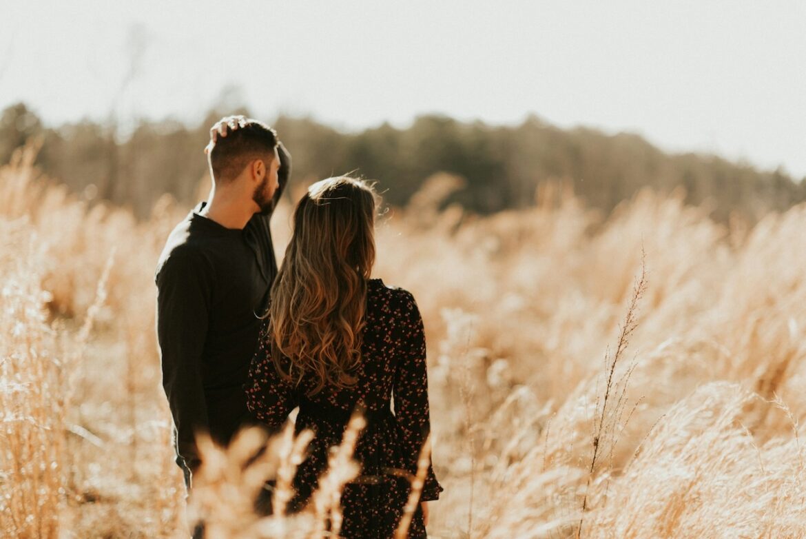 couple in a field deciding the relationship's fate with the key to right a wrong